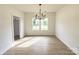 Spacious dining room with hardwood floors and chandelier at 3065 Swallowtail Ln, Kannapolis, NC 28083