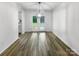 Light-filled dining room with hardwood floors and French doors leading to deck at 819 Brooklee Dr, Kings Mountain, NC 28086