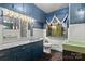 Bathroom with dark blue walls, a large vanity, and a shower at 702 Forest Hill Dr, Shelby, NC 28150