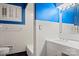 White tiled bathroom with a bathtub, toilet, and vanity at 702 Forest Hill Dr, Shelby, NC 28150