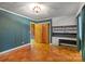 Bedroom with wood floors and built-in desk and cabinets at 702 Forest Hill Dr, Shelby, NC 28150