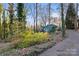 Teal ranch home with a long driveway and wooded lot at 702 Forest Hill Dr, Shelby, NC 28150