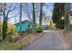 Teal ranch home with a long driveway and wooded lot at 702 Forest Hill Dr, Shelby, NC 28150