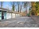 Three-car garage with white doors and teal trim at 702 Forest Hill Dr, Shelby, NC 28150