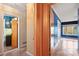 Hallway view of two rooms, one with blue walls and window, one with a green bathroom at 702 Forest Hill Dr, Shelby, NC 28150