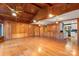 Spacious living room featuring wood-paneled walls and hardwood floors at 702 Forest Hill Dr, Shelby, NC 28150
