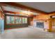 Living room with brick fireplace and wood paneled walls at 702 Forest Hill Dr, Shelby, NC 28150