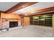 Living room featuring a brick fireplace and built-in shelves at 702 Forest Hill Dr, Shelby, NC 28150