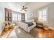 Bright bedroom with hardwood floors, large windows, and built-in shelving at 1208 South Point Rd, Belmont, NC 28012