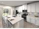 Modern kitchen featuring white cabinets and a large island at 155 Shepherds Landing Dr, Mooresville, NC 28115