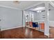 Spacious living room with hardwood floors and decorative columns at 3010 Berry Creek Rd, Charlotte, NC 28214