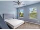 Spacious bedroom with two windows and a ceiling fan at 3010 Berry Creek Rd, Charlotte, NC 28214