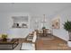 Open concept dining area with a stylish chandelier and wooden table at 5346 Johnston Mill Ct, Charlotte, NC 28269