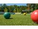 Close-up of bocce balls on a green court at 129 Sari St, Troutman, NC 28166