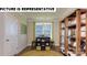 Home office with built-in shelving and large window at 117 Sari St, Troutman, NC 28166