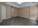 Primary bedroom with hardwood floors and access to bathroom at 12431 Jessica Pl, Charlotte, NC 28269