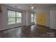 Bedroom with large windows and yellow doors at 12431 Jessica Pl, Charlotte, NC 28269