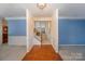 Open hallway with hardwood floors and view of staircase at 2060 E Foxwood Ct, Indian Land, SC 29707