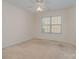 Bright bedroom with ceiling fan and carpeting at 2060 E Foxwood Ct, Lancaster, SC 29720