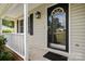 Front porch with white railings and a black front door at 4520 Huntington Dr, Gastonia, NC 28056