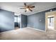 Bright bedroom with ceiling fan and access to another room at 4520 Huntington Dr, Gastonia, NC 28056