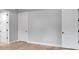 Spacious bedroom with light gray walls and hardwood floors at 1031 Seven Sisters Ave, Monroe, NC 28110