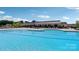 Sparkling community swimming pool with surrounding lounge chairs at 1031 Seven Sisters Ave, Monroe, NC 28110