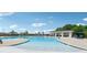 Community pool with lap lanes, lounge chairs, and a shaded seating area at 1031 Seven Sisters Ave, Monroe, NC 28110