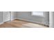 Light-filled bedroom featuring hardwood floors and neutral walls at 1031 Seven Sisters Ave, Monroe, NC 28110