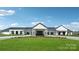 Modern farmhouse-style community building with landscaping at 1031 Seven Sisters Ave, Monroe, NC 28110