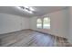 Bright room features wood-look floors and a door leading to outside at 268 Simrill St, Rock Hill, SC 29730