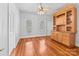 Hardwood floor dining room with built-in hutch and window at 405 7Th St, Spencer, NC 28159