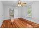 Spacious bedroom with hardwood floors and ceiling fan at 405 7Th St, Spencer, NC 28159