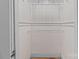 Shelved closet with white wood paneling at 405 7Th St, Spencer, NC 28159