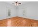 Bright bedroom with hardwood floors and two windows at 405 7Th St, Spencer, NC 28159