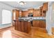 Kitchen with wood cabinets, island, and stainless steel appliances at 405 7Th St, Spencer, NC 28159