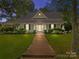 Charming two-story home with brick walkway and well-manicured lawn at 405 7Th St, Spencer, NC 28159