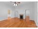 Living room featuring hardwood floors and a fireplace at 405 7Th St, Spencer, NC 28159