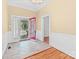 Inviting entryway with red door, tile flooring, and hardwood accents at 405 7Th St, Spencer, NC 28159