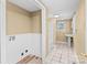 Convenient laundry room with washer/dryer hookups and adjacent bath at 405 7Th St, Spencer, NC 28159