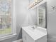 Bathroom with vanity, mirror, and window at 405 7Th St, Spencer, NC 28159