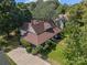 House with brown roof, large yard, and driveway seen from above at 405 7Th St, Spencer, NC 28159