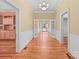 Hardwood floors and neutral wall tones in a long hallway at 405 7Th St, Spencer, NC 28159