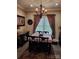Bright dining room with a table for six and decorative chandelier at 3486 Mason Spring Dr, Lincolnton, NC 28092