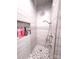 Spacious shower with built-in shelves and hexagon tile floor at 3486 Mason Spring Dr, Lincolnton, NC 28092