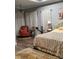Bright bedroom featuring a cozy armchair and large bed at 3486 Mason Spring Dr, Lincolnton, NC 28092
