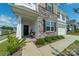 Inviting front porch with stonework and black door at 1148 Narrowmouth Ct, Lancaster, SC 29720