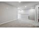 Spacious loft area with carpet and neutral color palette at 2335 Hedgecliff Rd # 14, Kannapolis, NC 28025