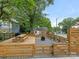 Fenced backyard with patio and picnic table at 2015 Pinckney Ave, Charlotte, NC 28205