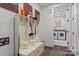 Convenient laundry room with washer, dryer, and built-in storage at 2008 Stratford Ave, Charlotte, NC 28205